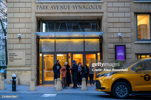 Daniel Lifshitz , Adam Lifshitz , Omer Lifshitz , Shira Matalon and others stand outside Park Avenue Synagogue on April 5, 2024 in New York City....