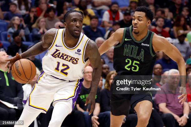 Taurean Prince of the Los Angeles Lakers drives against Trey Murphy III of the New Orleans Pelicans during the second half at Smoothie King Center on...
