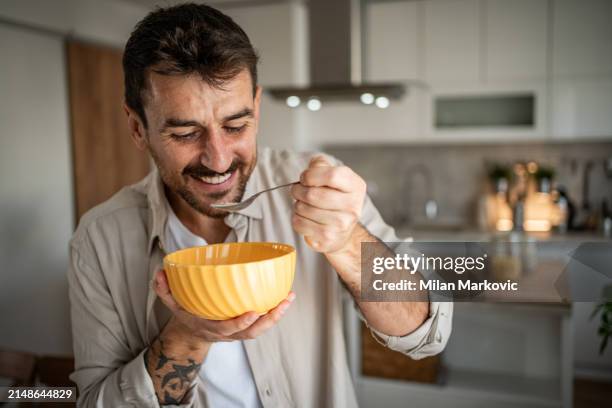 quiet weekend morning, i like to eat cornflakes for breakfast - spoon stock pictures, royalty-free photos & images