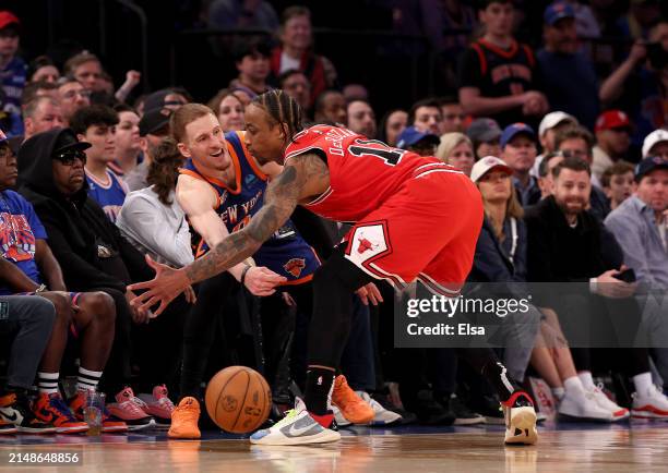Donte DiVincenzo of the New York Knicks tries to in bound the ball as DeMar DeRozan of the Chicago Bulls defends in the final minute of the game...