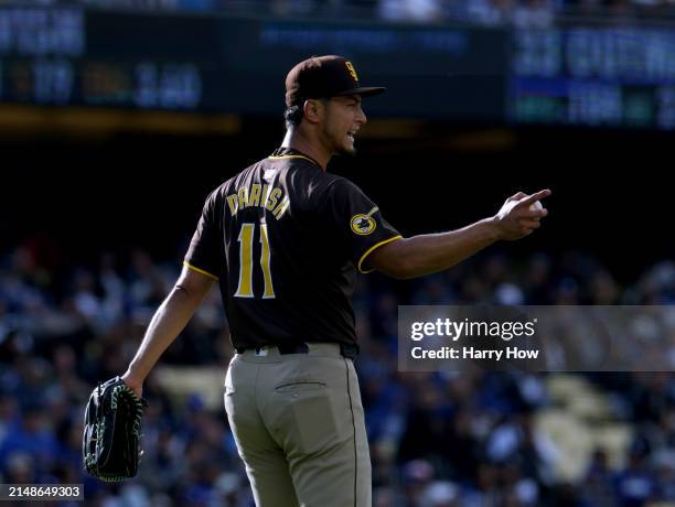 Yu Darvish of the San Diego Padres reacts to his defense for an out of James Outman of the Los Angeles Dodgers during the second inning at Dodger...