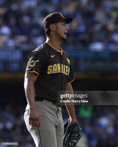 Yu Darvish of the San Diego Padres reacts to his defense for an out of James Outman of the Los Angeles Dodgers during the second inning at Dodger...