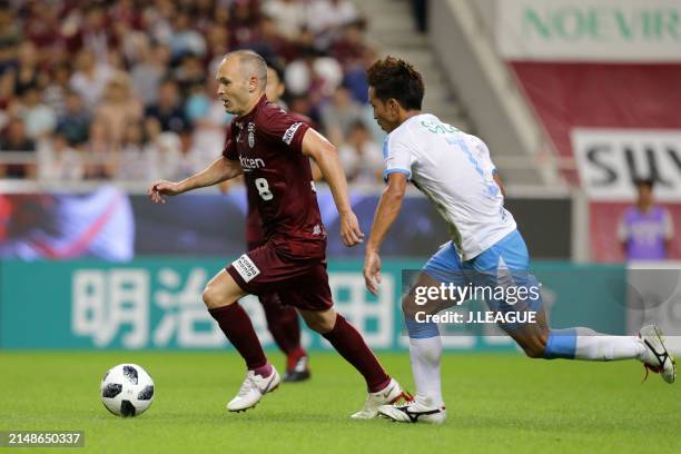 Andres Iniesta of Vissel Kobe controls the ball against Taishi Taguchi of Júbilo Iwata during the J.League J1 match between Vissel Kobe and Júbilo...