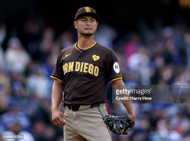 Yu Darvish of the San Diego Padres reacts to a Will Smith of the Los Angeles Dodgers RBI single, to take a 3-1 lead, during the fourth inning at...