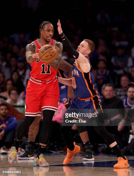 DeMar DeRozan of the Chicago Bulls tries to pass as Donte DiVincenzo of the New York Knicks defends during the first half at Madison Square Garden on...