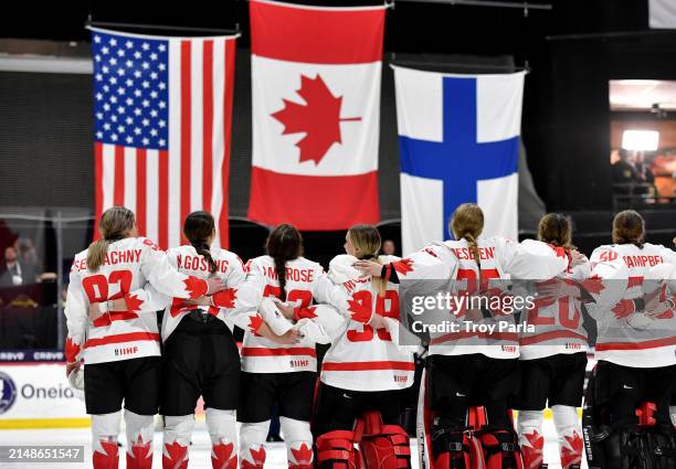 Danielle Serdachny, Nicole Gosling, Erin Ambrose, Emerance Maschmeyer, Ann-Renee Desbiens, Sarah Nurse and Kristen Campbell of Canada watch as the...