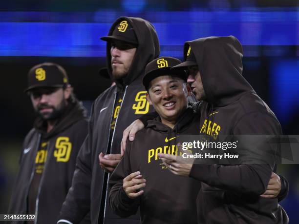 Yuki Matsui of the San Diego Padres celebrates a 6-3 win over the Los Angeles Dodgers with Tom Cosgrove and Joe Musgrove at Dodger Stadium on April...