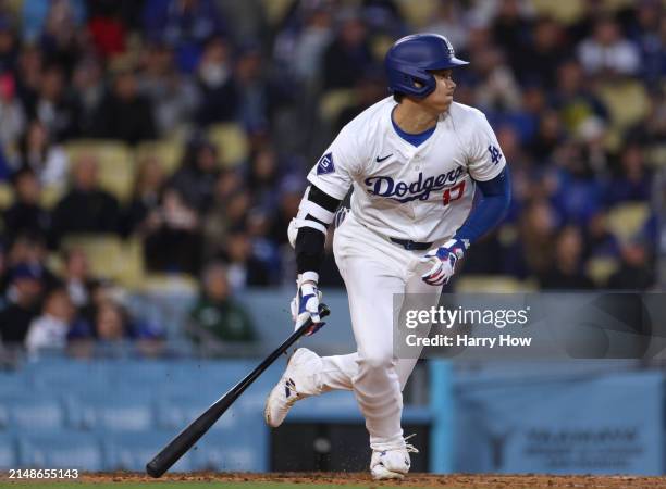 Shohei Ohtani of the Los Angeles Dodgers hits a single during the eighth inning in a 6-3 loss to the San Diego Padres at Dodger Stadium on April 14,...