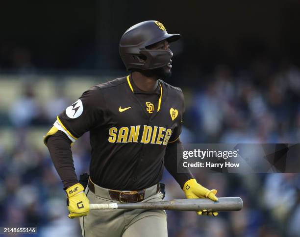 Jurickson Profar of the San Diego Padres reacts to his three run double, to take a 6-3 lead over the Los Angeles Dodgers, during the seventh inning...