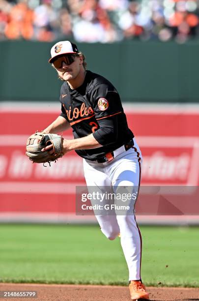 Gunnar Henderson of the Baltimore Orioles throws the ball to first base against the Milwaukee Brewers at Oriole Park at Camden Yards on April 13,...