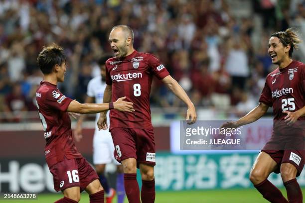 Andres Iniesta of Vissel Kobe celebrates with teammates Kyogo Furuhashi and Leo Osaki after scoring the team's first goal during the J.League J1...
