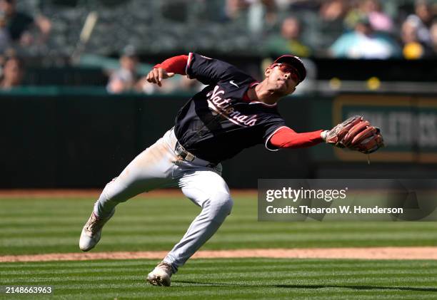 Trey Lipscomb of the Washington Nationals catches a pop-up on the infield hit by Ryan Noda of the Oakland Athletics in the bottom of the eighth...