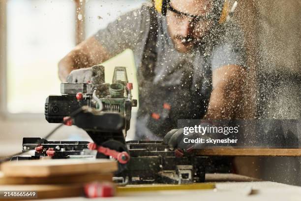 cutting wood plank with electric saw! - serra-circular imagens e fotografias de stock