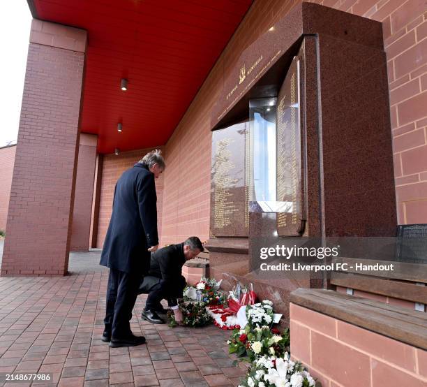 Sir Kenny Dalglish and Billy Hogan laying a wreath at the Hillsborough memorial at Anfield in this handout image provided by Liverpool FC on April...