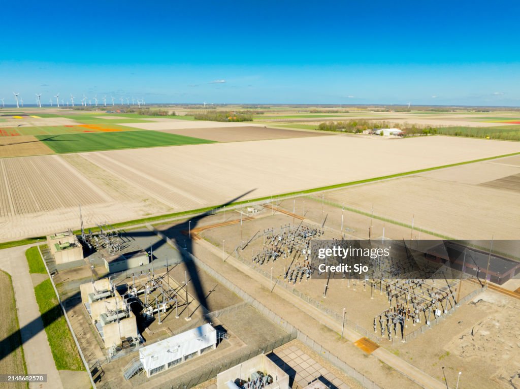 High voltage substation with a wind turbine shadow