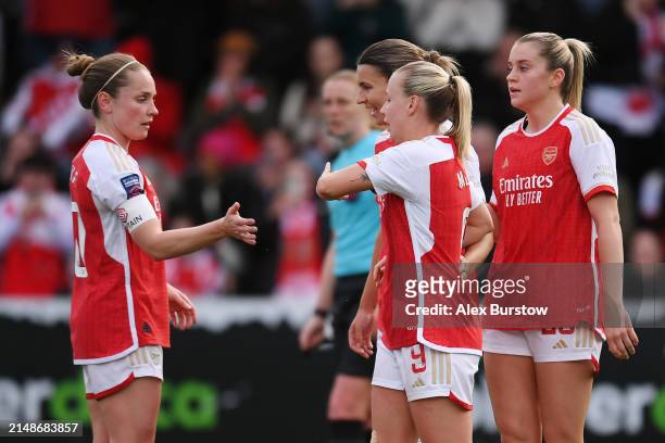 Beth Mead of Arsenal celebrates with teammates Kim Little, Steph Catley and Alessia Russo after scoring her team's second goal during the Barclays...