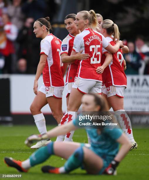 Beth Mead of Arsenal celebrates with teammates Caitlin Foord, Steph Catley and Stina Blackstenius after scoring her team's second goal during the...