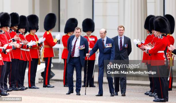 Prince Edward, Duke of Kent is applauded by soldiers of the Scots Guards and association veterans as he departs after attending the Scots Guards...