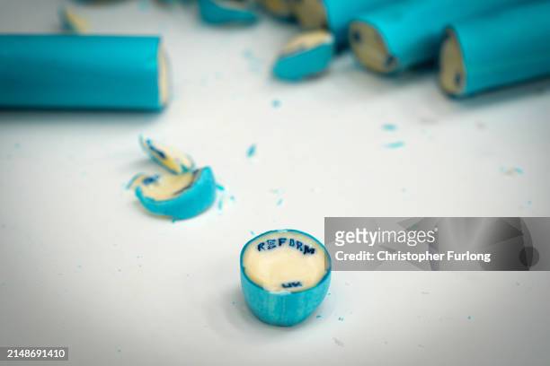 Workers at Rainbow Candies produce lettered Reform UK Party seaside rock on April 15, 2024 in Blackpool, England. Reform UK leader Richard Tice...