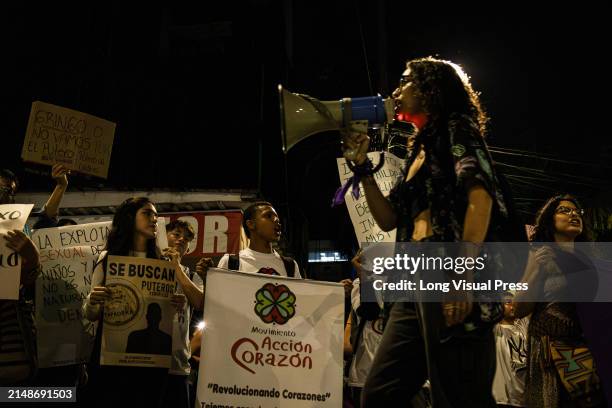 People demonstrate against sexual exploitation of minors in the city of Medellin, Colombia on April 9 after the alleged case of Timothy Alan...