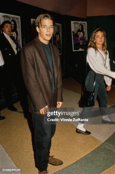 Canadian actor Rodney Eastman, wearing a brown checked blazer over a black crew-neck top and black trousers, attends the Century City premiere of...