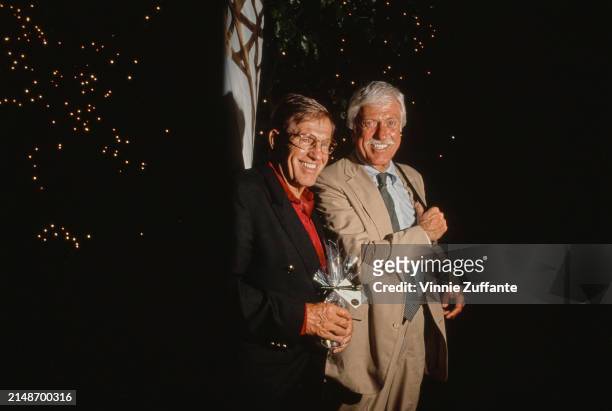 American actor Jerry Van Dyke, wearing a black blazer over a red shirt, and his brother, American actor and comedian Dick Van Dyke, who wears a beige...