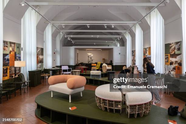 Two young women visit the exhibition "Nuancier Nomade" by Le FRENCH DESIGN 100, at Institut Français de Milan, during the Milan Design Week 2024 on...