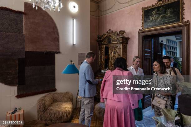 People visit the exhibition "L'Appartamento" by Artemest, located at Residenza Vignale, during the Milan Design Week 2024 on April 15, 2024 in Milan,...