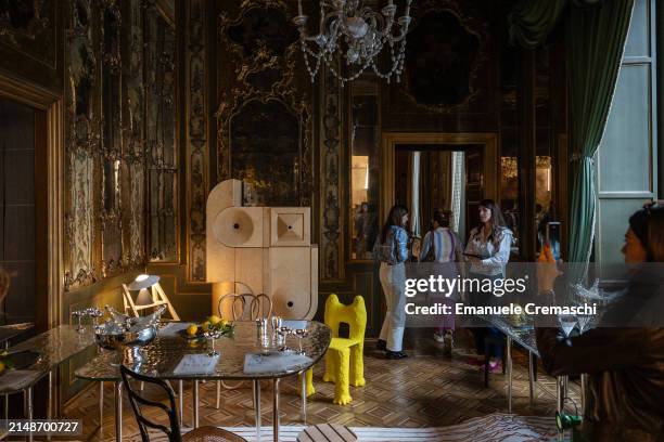 People visit the exhibition "L'Appartamento" by Artemest, located at Residenza Vignale, during the Milan Design Week 2024 on April 15, 2024 in Milan,...