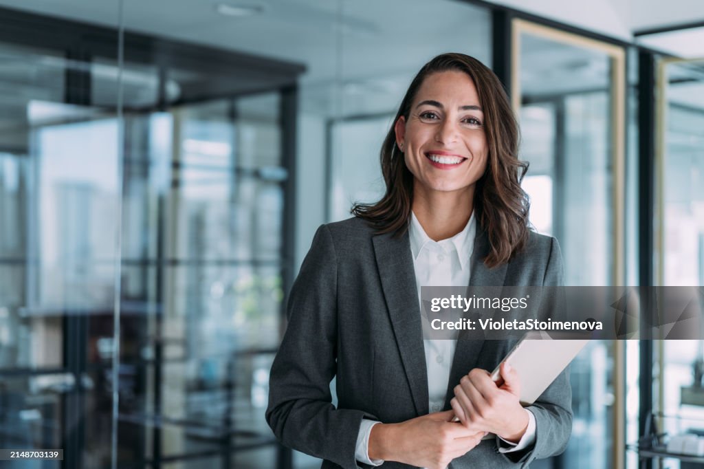 Confident businesswoman in modern office.