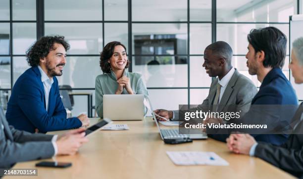 business persons on meeting in the office. - trabajo en equipo fotografías e imágenes de stock