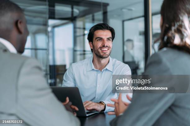 group of business persons talking in the office. - sale stock pictures, royalty-free photos & images