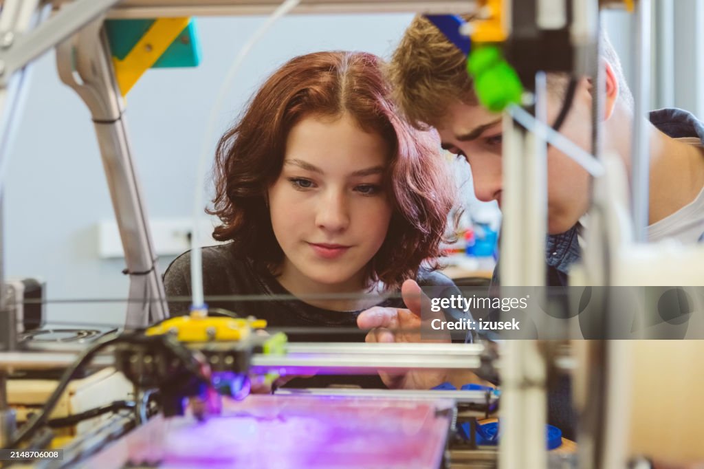 High school students watching 3d print