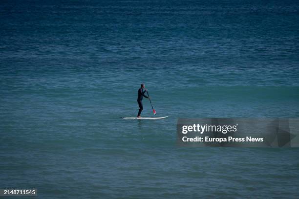 Man paddle-surfs on the beach of Bogatell, on 15 April, 2024 in Barcelona, Catalonia, Spain. Catalonia has registered this April 13 and 14 a "hot"...