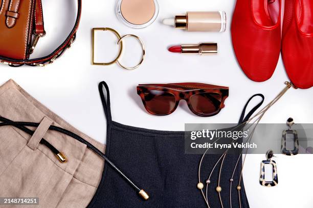 set of fashion collection with trendy fashion clothes and make-up cosmetic products for women in red, beige, brown and black colours. - gold shoe stock pictures, royalty-free photos & images