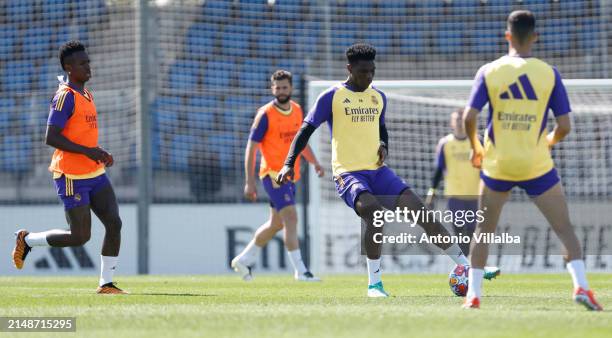 Aurelien Tchouameni player of Real Madrid is training with teammates Vinicius Junior and Lucas Vazquez at Valdebebas training ground on April 15,...