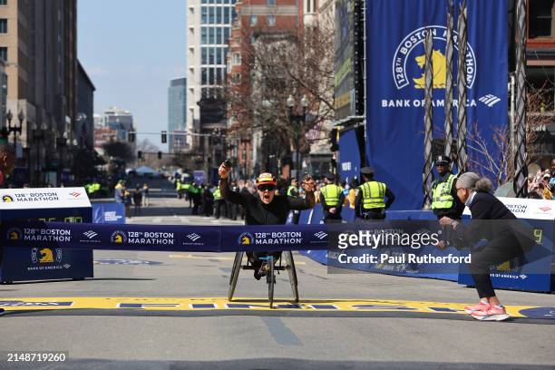 Eden Rainbow Cooper of Great Britain crosses the finish line to win the Professional Women's Wheelchair Division at the 128th Boston Marathon on...