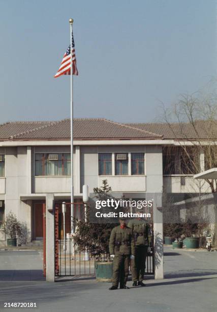Two Chinese soldiers standing outside the United States embassy to China in Peking, March 1st 1979.