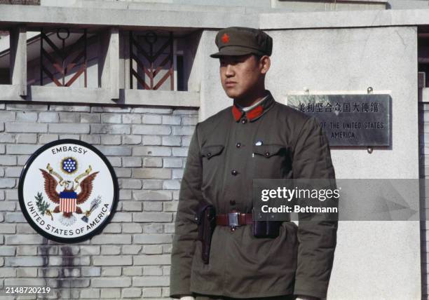 Chinese soldier standing outside the United States embassy to China in Peking, March 1st 1979. The embassy plaque was unveiled during a visit by...