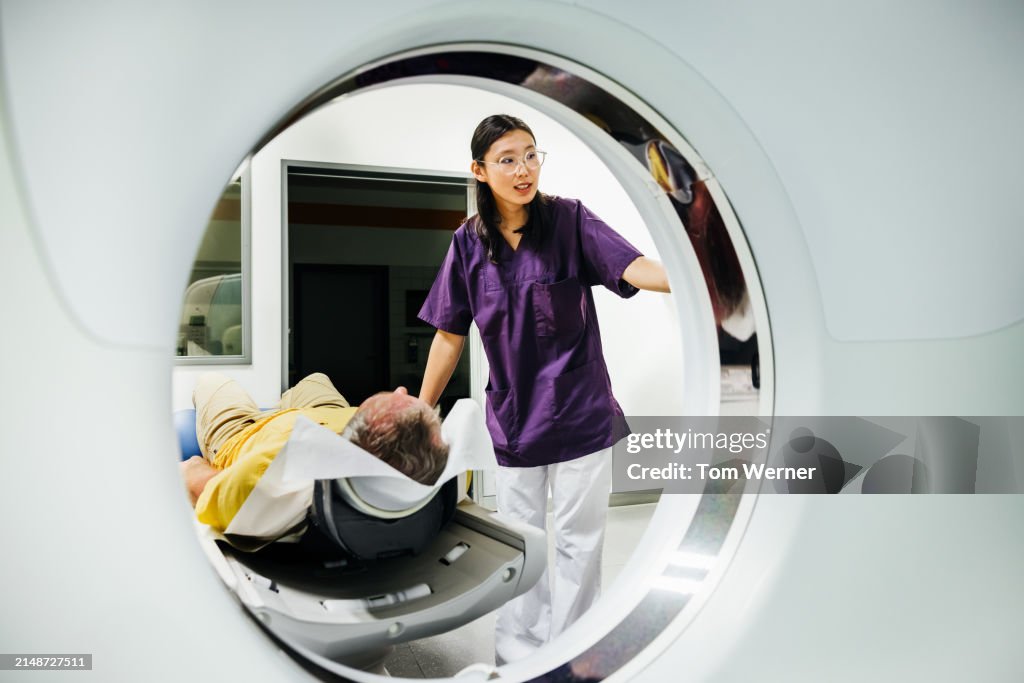 Patient Undergoing a CT Scan with Technician
