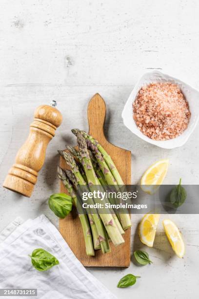 asparagus. cooking bunch of asparagus on kitchen table. top view - slovakia country stock pictures, royalty-free photos & images