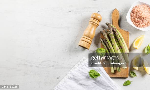 asparagus. cooking bunch of asparagus on kitchen table. top view - slovakia country stock pictures, royalty-free photos & images