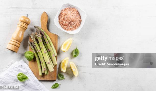 asparagus. cooking bunch of asparagus on kitchen table. top view - slovakia country stock pictures, royalty-free photos & images