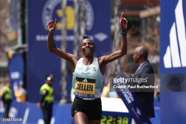 Hellen Obiri of Kenya crosses the finish line and takes firs t place in the professional Women's Division during the 128th Boston Marathon on April...