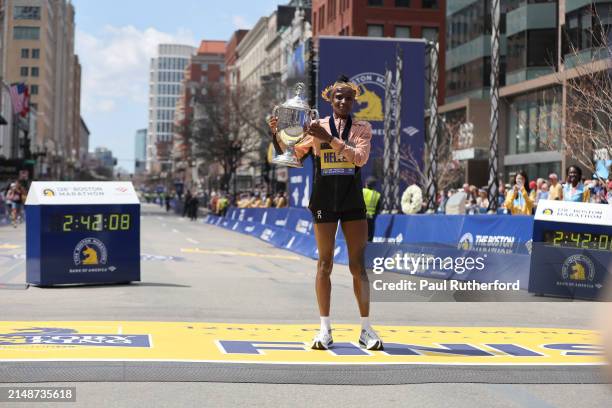 Hellen Obiri of Kenya poses with the trophy after winning the professional Women's Division during the 128th Boston Marathon on April 15, 2024 in...