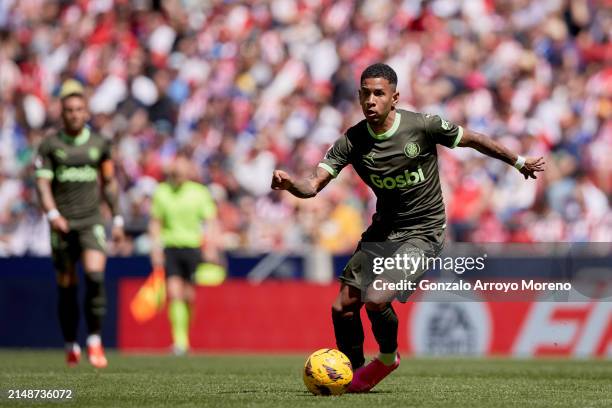 Savio Moreira of Girona FC controls the ball during the LaLiga EA Sports match between Atletico Madrid and Girona FC at Civitas Metropolitano Stadium...