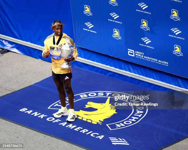 Sisay Lemma of Ethiopa poses with the trophy after winning the Professional Men's Division during the 128th Boston Marathon on April 15, 2024 in...