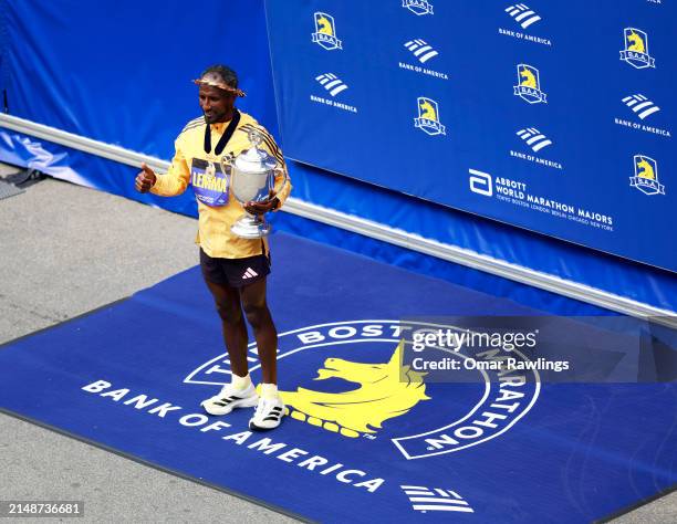 Sisay Lemma of Ethiopa poses with the trophy after winning the Professional Men's Division during the 128th Boston Marathon on April 15, 2024 in...