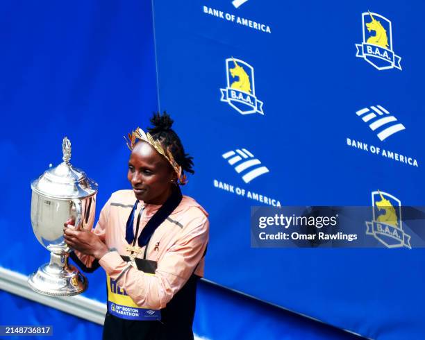 Hellen Obiri of Kenya poses with the trophy after winning the Professional Women's Division during the 128th Boston Marathon on April 15, 2024 in...