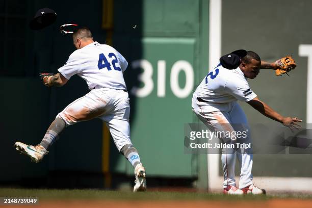 Tyler O'Neill of the Boston Red Sox, left, and Rafael Devers of the Boston Red Sox collide during the seventh inning of a game between the Boston Red...